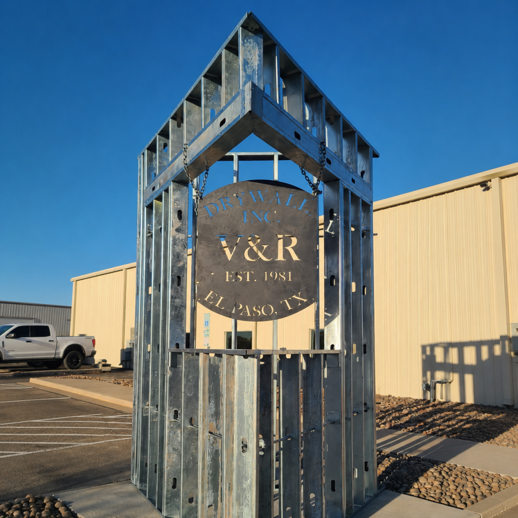 V and R Drywall company sign and commercial framing display